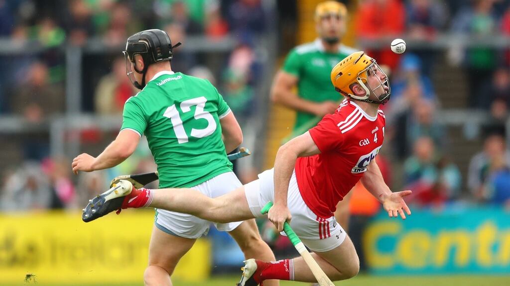 Limerick’s Peter Casey and Niall O’Leary of Cork during their clash at the Gaelic Grounds, Limerick. Photograph: James Crombie/Inpho