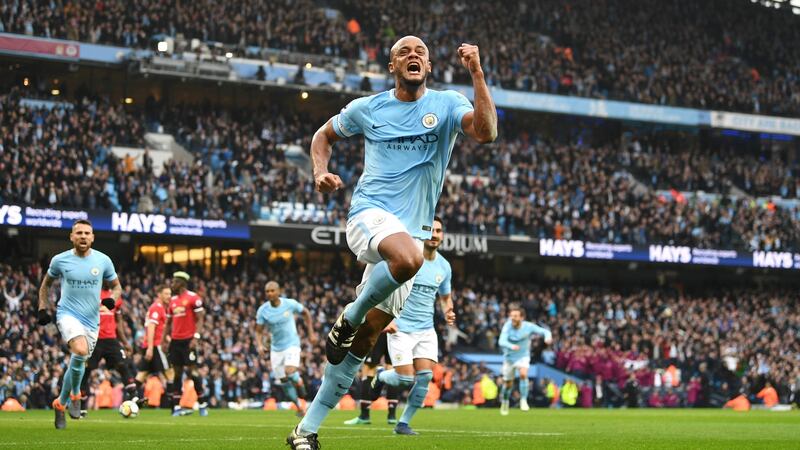 Vincent Kompany celebrates after giving Manchester City the lead in their Premier League match against Manchester United at Etihad Stadium. Photograph: Michael Regan/Getty Images