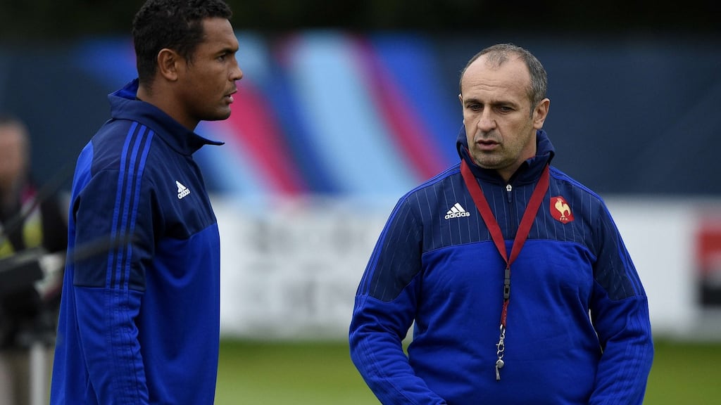 France’s head coach Philippe Saint André (right) speaks with his captain Thierry Dusautoir during a training session at Newport High School ahead of the World Cup quarter-final match against New Zealand. Photograph: Getty.
