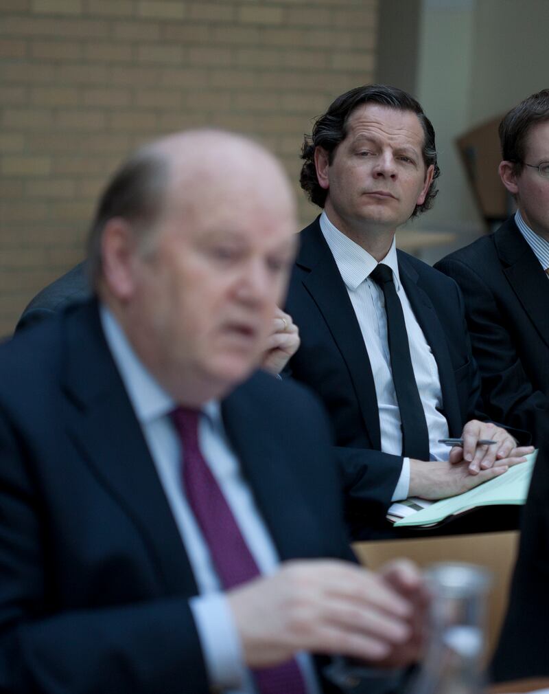 Then minister for finance Michael Noonan speaks to the media in Dublin as his secretary general of the department John Moran looks on. Moran later became a lobbyist for Uber