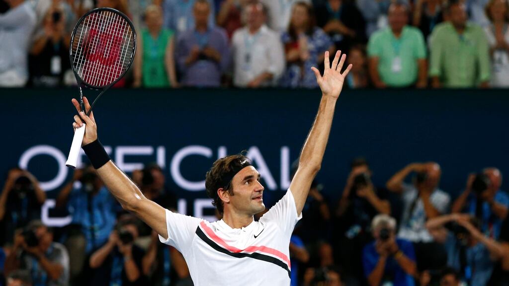 Switzerland’s Roger Federer celebrates winning the Australian Open final, his 20th Grand Slam title, against Croatia’s Marin Cilic at the Rod Laver Arena in Melbourne. Photograph: Edgar Su/Reuters