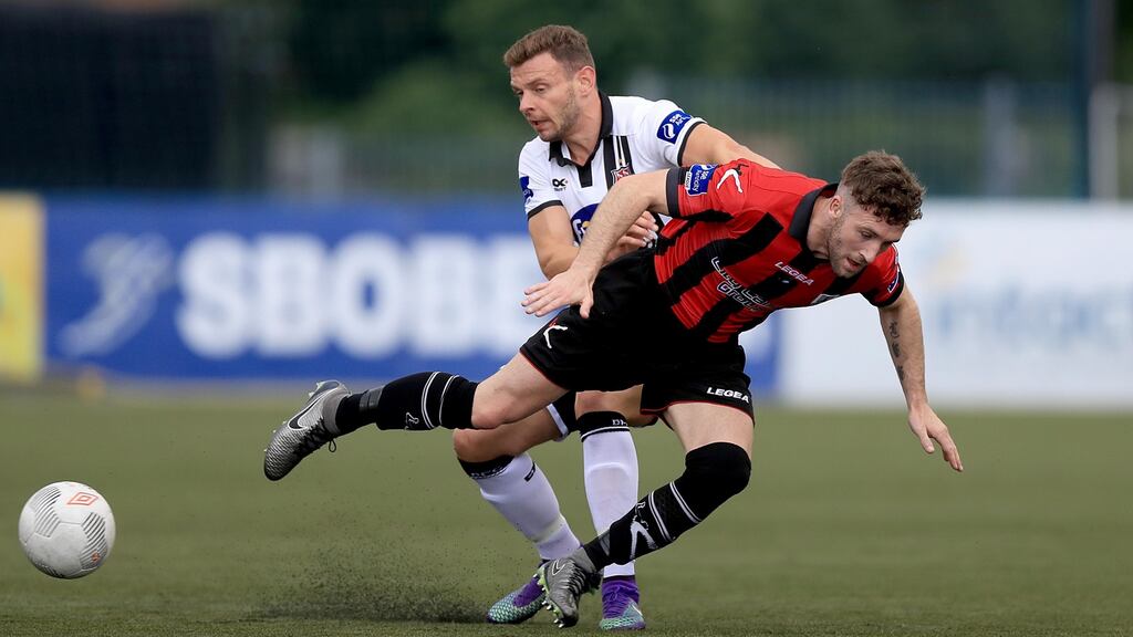 Andy Boyle of Dundalk tackle Longford’s Lee Duffy during their Airtricity League clash at Oriel Park. Photo: Inpho