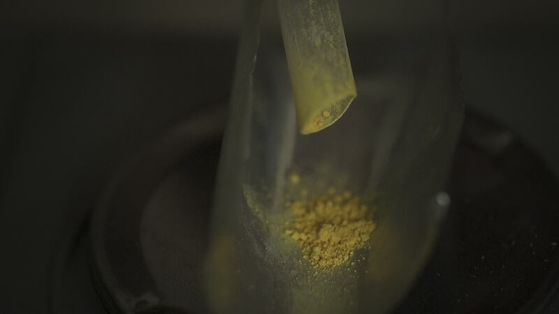 Zhang Zhejun makes his own drugs from ingredients purchased online to give to his mother, who suffered from lung cancer, in Hebei, China. His mother died months after this image was recorded. Photograph: Jonah M. Kessel/The New York Times