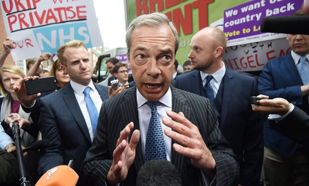 UKIP leader Nigel Farage (C) speaks to reporters during the launch of a new poster campaign ahead of the EU referendum in Smith Square in London. Photograph: Facundo Arrizabalaga/EPA