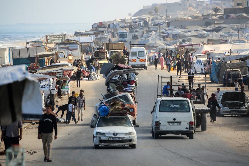 Palestinians leave Gaza city on Wednesday after the Israeli military issued evacuation orders to the civilian population. Photograph: Eyad Baba/AFP/Getty