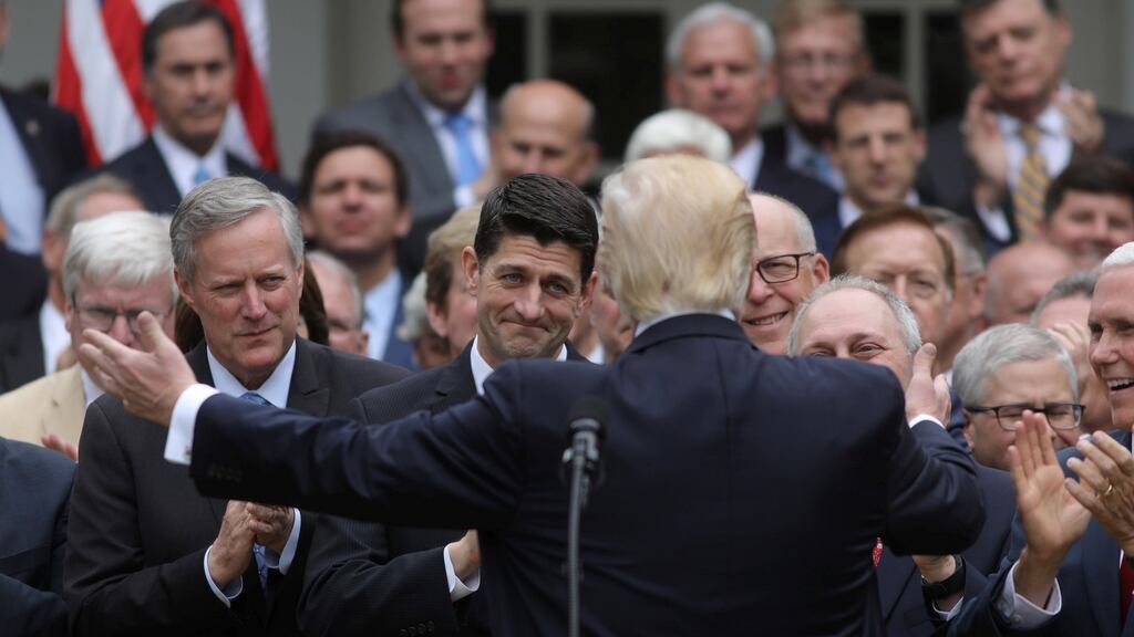 Donald Trump turns to Paul Ryan in the Rose Garden of the White House: The president feted his fake-news “win” there, sprinkling flimflam dust to deflect from his ludicrous legislation. Photograph: Carlos Barria/Reuters