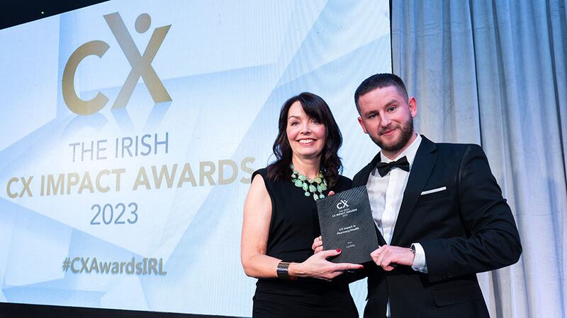Jenny McCoy, awards judge, presents the CX impact in pharmacy/health award to Adam Kane, on behalf of Leckey.