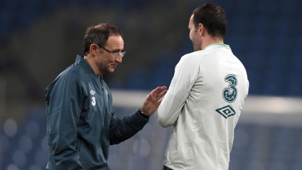 Republic of Ireland manager Martin O’Neill with John O’Shea during last night’s training session at the Municipal Stadium in Poznan. Photograph: Donall Farmer/Inpho