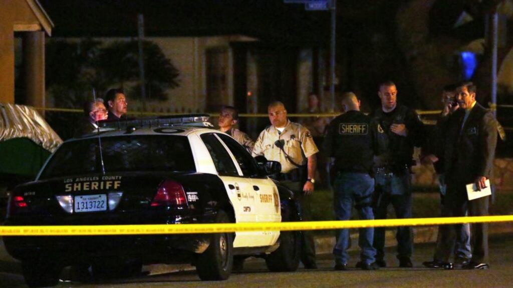Los Angeles County Sheriff’s deputies and investigators stand near the scene where a pedestrian was killed in a hit-and-run crash reportedly involving rap mogul Marion “Suge” Knight in Compton, California. Photograph: Jonathan Alcorn/Reuters.