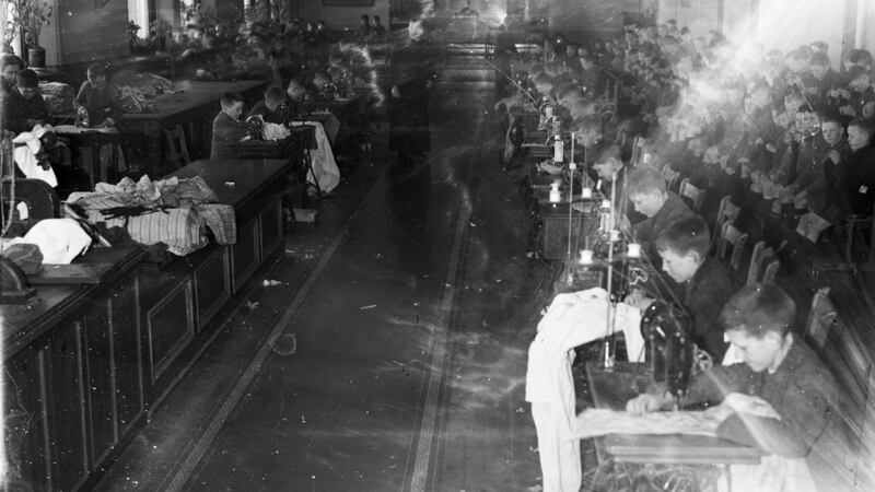 Boys sewing at  St Joseph’s Industrial School, Artane circa 1941. It was  run by the Christian Brothers in Artane, Dublin for almost a century from 1870 to 1969. Photograph: NLI Collection/Independent News And Media/Getty Images