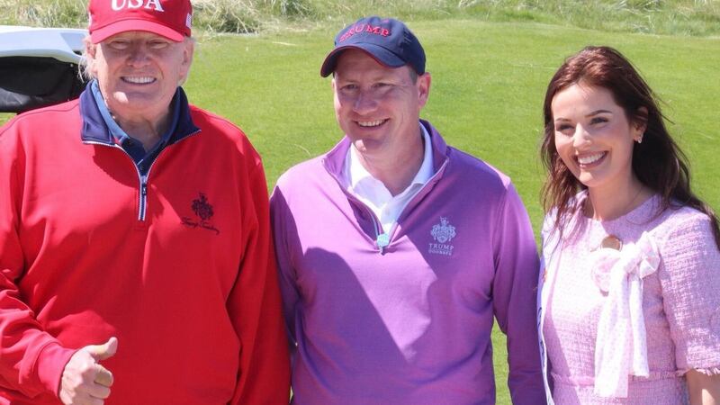 US president Donald Trump with Doonbeg resort staff members Brendan Murphy and ,Victoria O’Connell, a former Clare Rose.