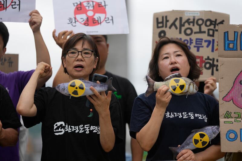 Members of an environmental group shout slogans during a rally to demand the halting of the Japanese government’s decision in Seoul, South Korea. Photograph: Lee Jin-man, AP