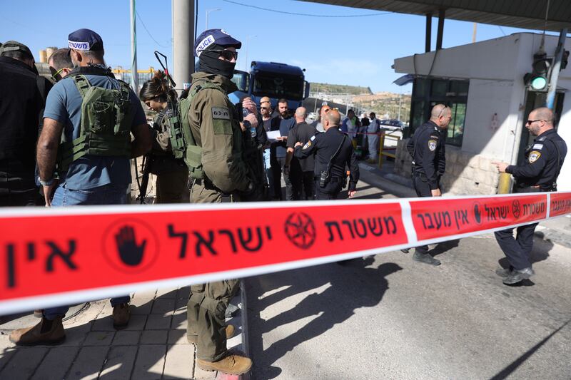 Israeli forces secure the site of a stabbing attack at a checkpoint, west of Bethlehem in the occupied West Bank. Two Israelis were injured in the stabbing and the attacker was shot by police. Photograph: Abir Sultan/EPA