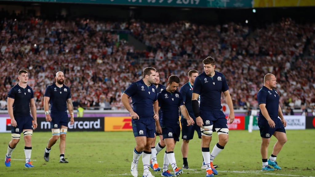 Scotland players leave the pitch after being knocked out of the Rugby World Cup by Japan. Photo: Odd Andersen/Getty Images