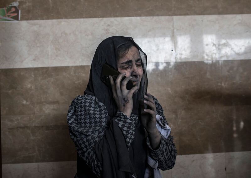 On the phone at Nasser Hospital in Khan Younis following Israeli air strikes. Photograph: EPA/EPE