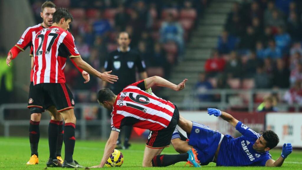 Diego Costa of Chelsea clashes with John O’Shea of Sunderland during the Premier League match at Stadium of Light. Photograph: Alex Livesey/Getty Images