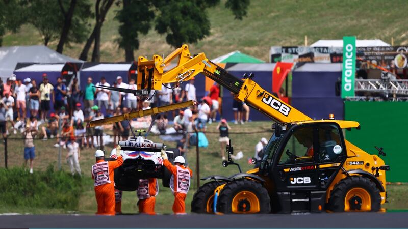 The Haas F1 car of Mick Schumacher  is removed from the track after a crash during final practice  at the Hungaroring. Photograph: Bryn Lennon/Getty Images