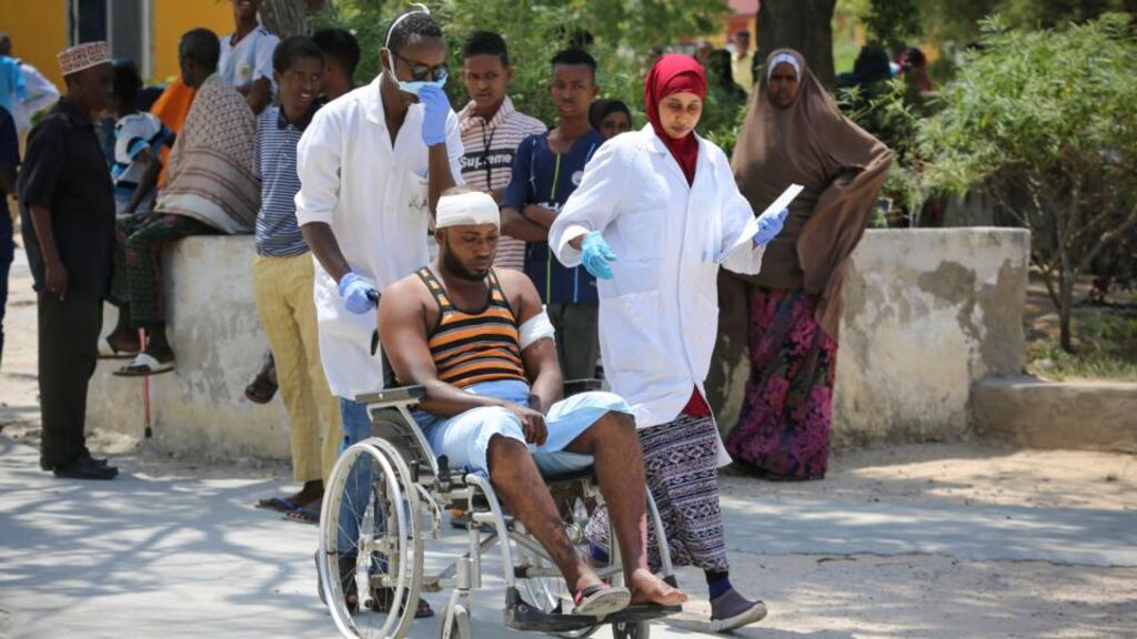 A man who was injured in the blast is carried on a wheelchair at Medina hospital in Mogadishu, Somalia on July 22nd. Photograph:  Said Yusuf Warsame/EPA