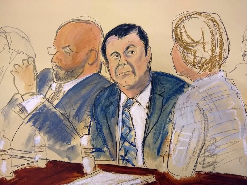 In this courtroom sketch Joaquin “El Chapo” Guzman (center) sits next to his defense attorney Eduardo Balazero (left) for opening statements as Guzman’s high-security trial gets underway in New York on Tuesday, November 13th Photograph: Elizabeth Williams/AP