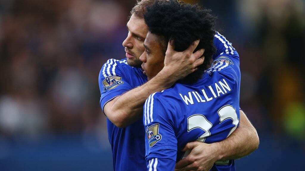 Branislav Ivanovic of Chelsea celebrates scoring his team’s first goal against Watford with his team mate Willian. Photograph: Clive Rose/Getty Images