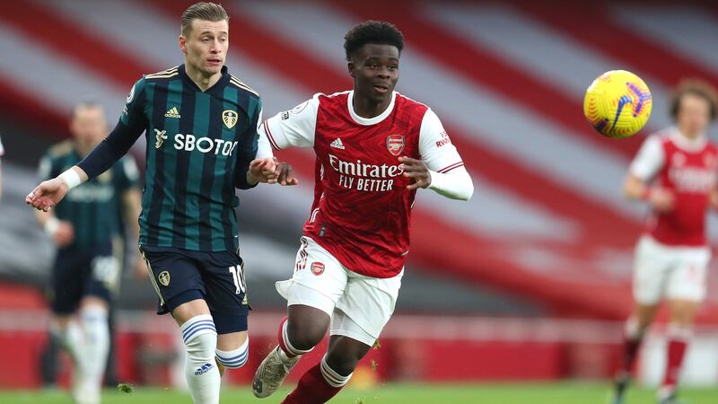 Bukayo Saka evades Ezgjan Alioski during Arsenal’s win over Leeds. Photograph: Catherine Ivill/EPA