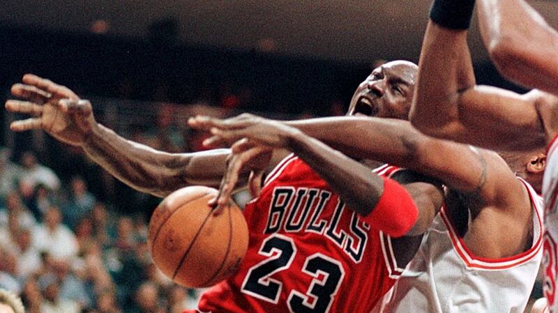 Michael Jordan of the Chicago Bulls gets fouled as he drives to the basket. The NBA in the 80s and 90s featured reckless fouls, frequent brawls and a relentless physical confrontation between players. Photograph: Tony Ranze//AFP via Getty Images