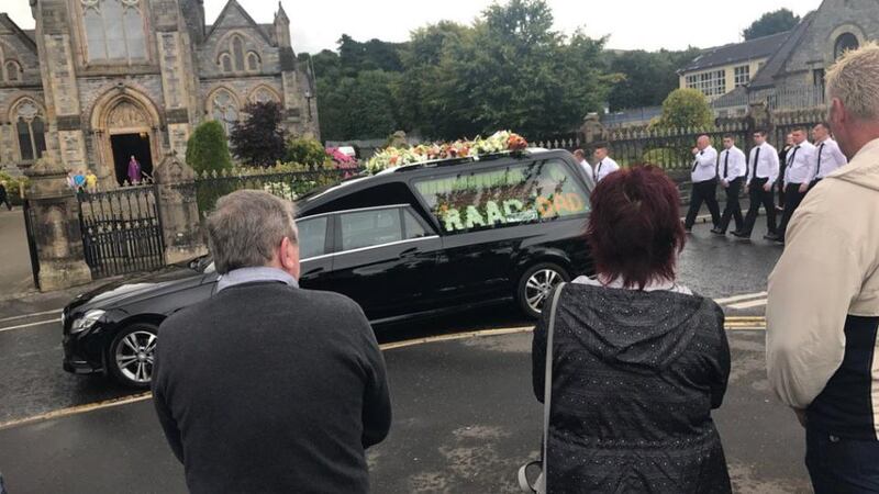 The funeral cortège of Kevin ‘Flat Cap’ Murray makes its way to Strabane cemetery. Photograph: Gerry Moriarty