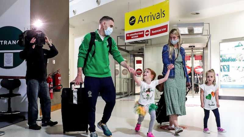 Jason Smyth is welcomed back to Belfast City Airport by his family. Photograph: Kelvin Boyes/Inpho