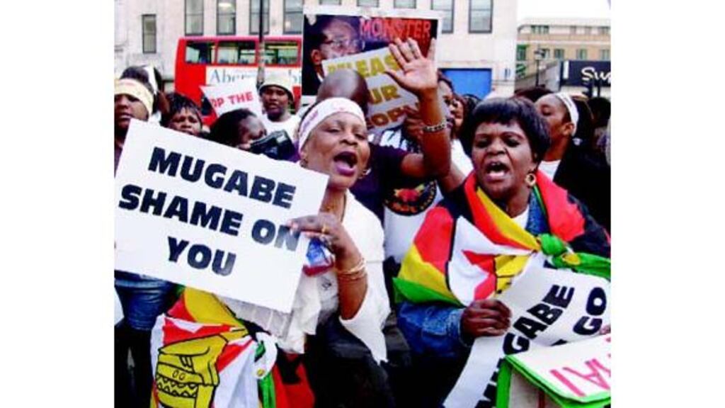 Women protesting against Robert Mugabes dictatorship outside the
Zimbabwean embassy in London.