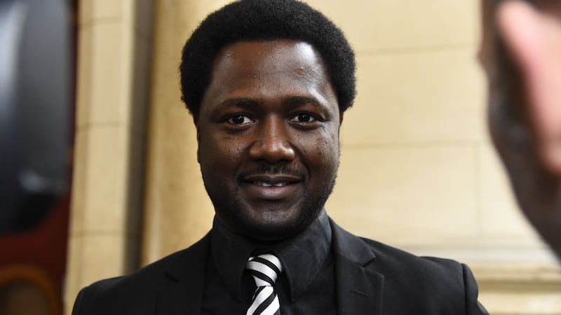 Souleymane Sylla speaks to the press at the Palais de Justice in Paris during the trial of four British men accused of racist violence towards him in February 2015. The four were convicted. Photograph: Bertrand Guay/AFP/Getty Images