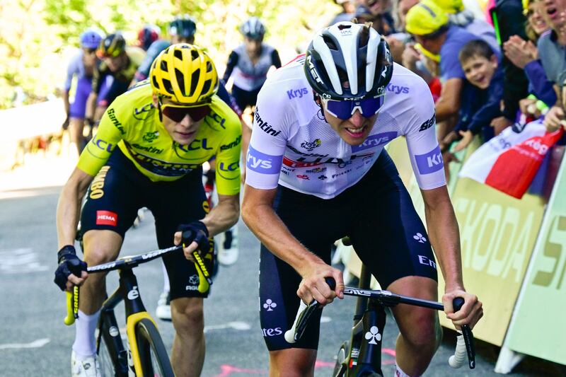 Tadej Pogacar wearing the best young rider's white jersey cycles ahead of Jumbo-Visma's Danish rider Jonas Vingegaard in the final ascent of Col du Grand Combier late in the 13th stage of the Tour de France. Photograph: Bernard Papon/Pool/AFP/Getty Images