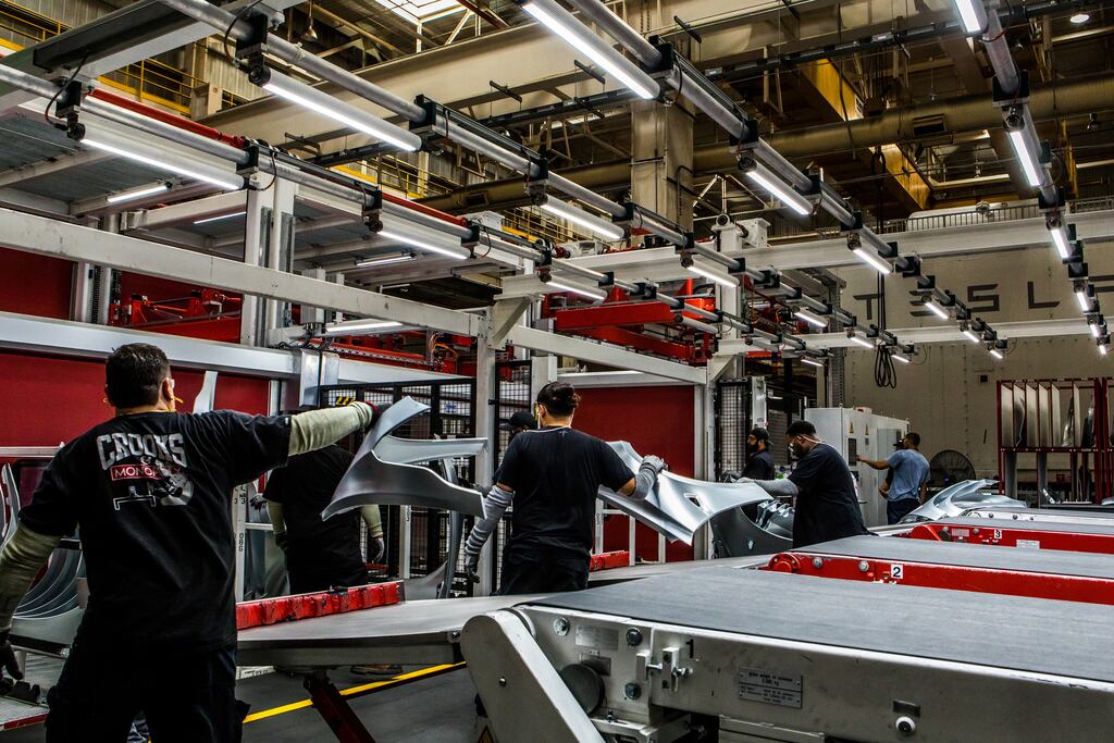 Workers at the Tesla factory in California: Elon Musk says workers must spend a minimum of 40 hours a week in the office. Photograph: Christie Hemm Klok/The New York Times
