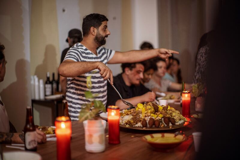 The Great Oven team member Ehab Olbe cooking at the Beirut headquaters