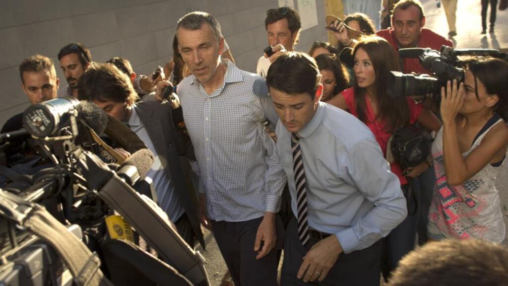 Brett King (centre) leaves the Materno Infantil Hospital in Malaga. Photograph: Sergio Camacho/Getty Images