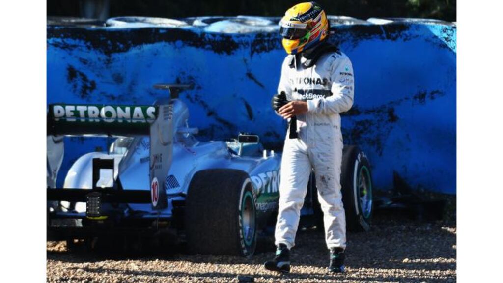 Lewis Hamilton walks away from his Mercedes after crashing at turn six during winter testing at Circuito de Jerez. Photograph: Paul Gilham/Getty Images