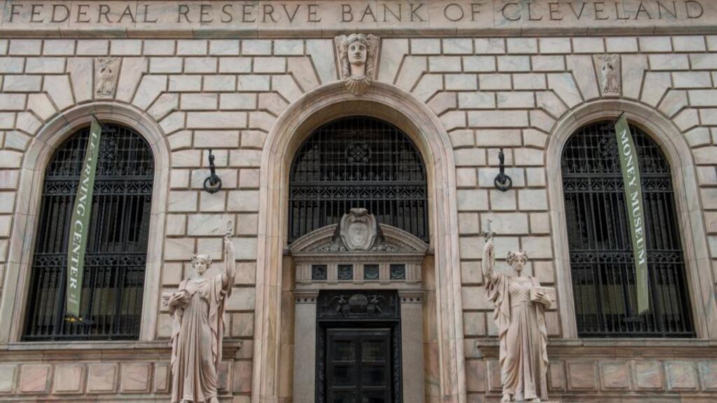 The Federal Reserve Bank of Cleveland stands on in Cleveland, Ohio, US. The US Federal Reserve has said growth had accelerated in the US as it slowed asset purchases by another $10 billion. Photographer: Ron Antonelli/Bloomberg