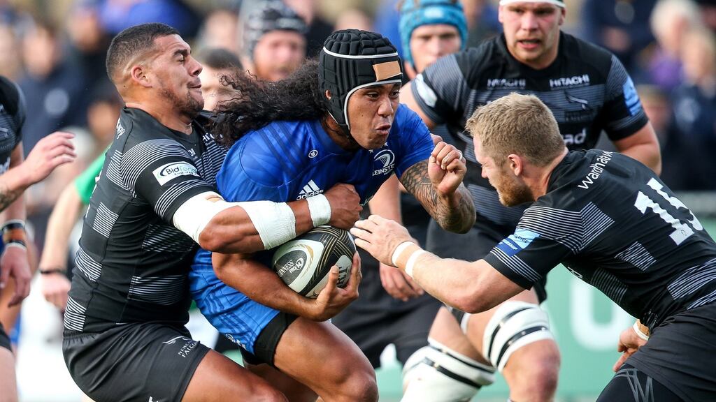 Leinster’s Joe Tomane tackled by Josh Matavesi and Alex Tait of Newcastle during the pre-season friendly at Donnybrook. Photograph: Gary Carr/Inpho
