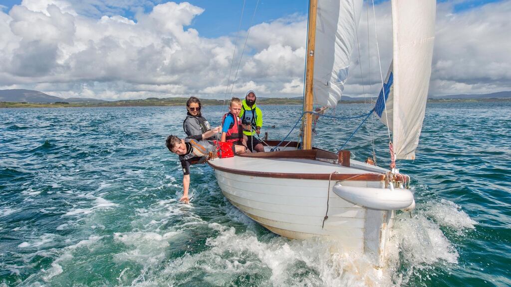 Kevin McCormack, who runs the Heir Island Sailing School in West Cork, with some of his young students. Photograph: Michael Mac Sweeney/Provision