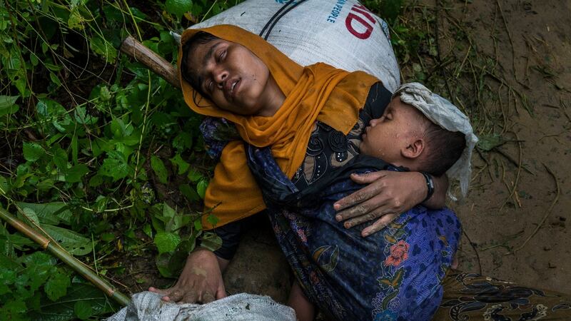 Shamsu Nahar, a Rohingya refugee, collapses with exhaustion and chest pains after crossing the border illegally near Amtoli, Bangladesh, on August 31st. Photograph: Adam Dean/New York Times