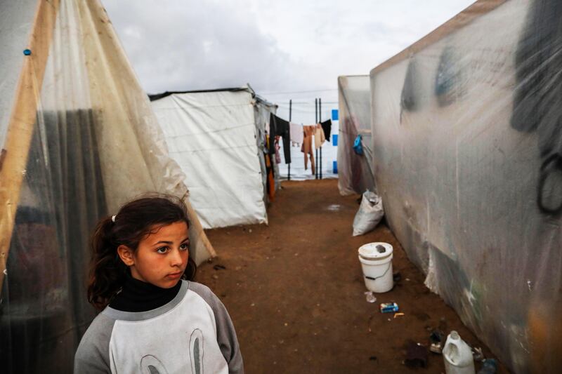 Displaced young Palestinians in their tented camp in Rafah, Gaza on Tuesday, as the number of Palestinians killed since October 7th exceeds 25,000. Photograph: Ahmad Hasaballah/Getty Images