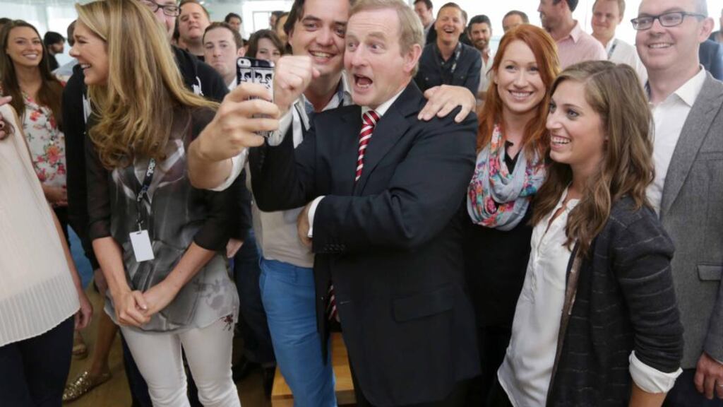 Online advertising company Adroll was one of the IDA’s hits this year. Pictured are Adroll staff member Alan O’Donovan, taking a selfie with  Taoiseach Enda Kenny, at its European headquarters in Dublin where it  announced 100 new jobs last month. Photograph: Laura Hutton/Photocall Ireland