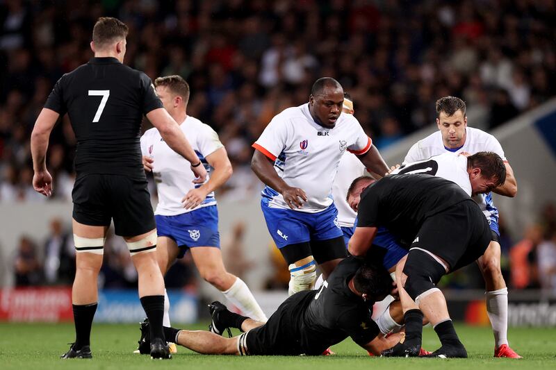 Adriaan Booysen of Namibia is tackled by Ethan de Groot of New Zealand, which later results in a red card for de Groot, at Stadium de Toulouse on Friday. Photograph: Catherine Ivill/Getty Images