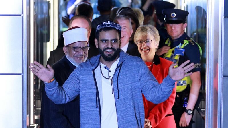Ibrahim Halawa: the lift doors open on the freed Irishman, his father and Minister for Youth Affairs Katherine Zappone. Photograph: Nick Bradshaw