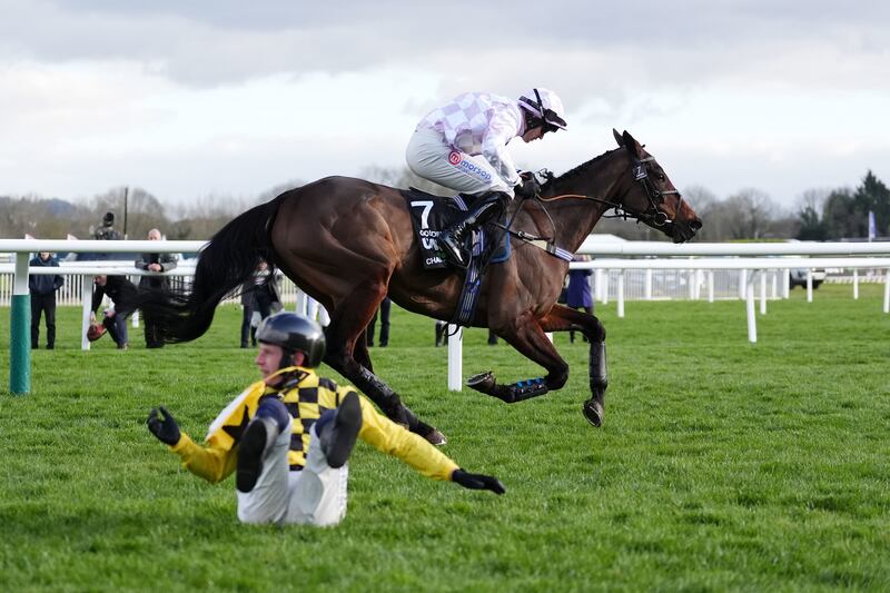 Paul Townend falls from State Man as Golden Ace ridden by Lorcan Williams goes on to win the Unibet Champion Hurdle. Photograph: Adam Davy/PA Wire
