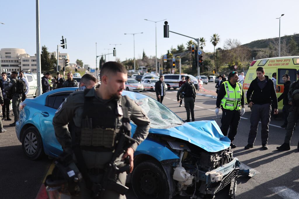 Israeli security forces and rescuers work at the site of a car ramming attack in Jerusalem on Friday. Photograph: EPA