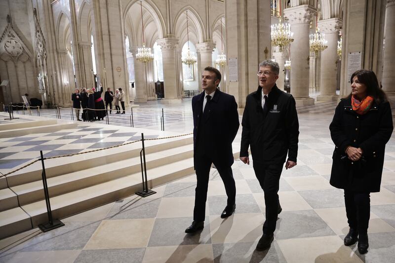 French president Emmanuel Macron, president of the Rebatir Notre-Dame de Paris public establishment Philippe Jost and Paris' mayor Anne Hidalgo. Photograph: Christophe Petit Tesson/AFP/Getty Images