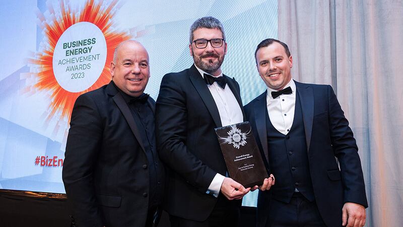 Conall Bolger, awards judge, presents the overall energy achievement award to Ian Hunter and Drew Armstrong, Swords Pavilions