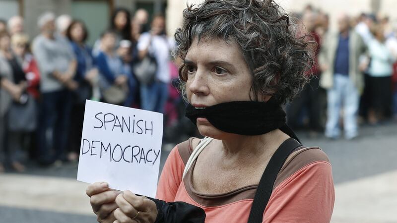 A protester during the protest gathering held at Sant Jaume square in Barcelona. Photograph: Andreu Dalmau/EPA