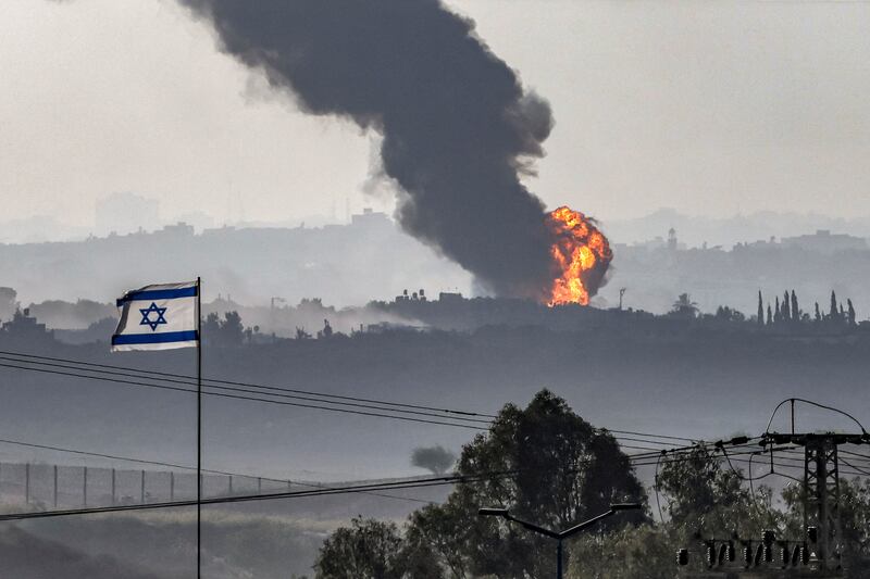 An Israeli flag flies at a position in southern Israel while across the border in the Gaza Strip a fireball erupts during Israeli bombardment on November 8th. Photograph: Ronaldo Schemidt/ AFP/Getty