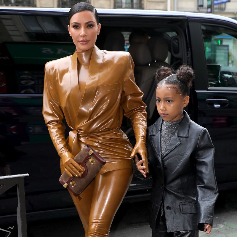 Proud mother: Kim Kardashian with her daughter North West in Paris last year. Photograph: Pierre Suu/GC/Getty
